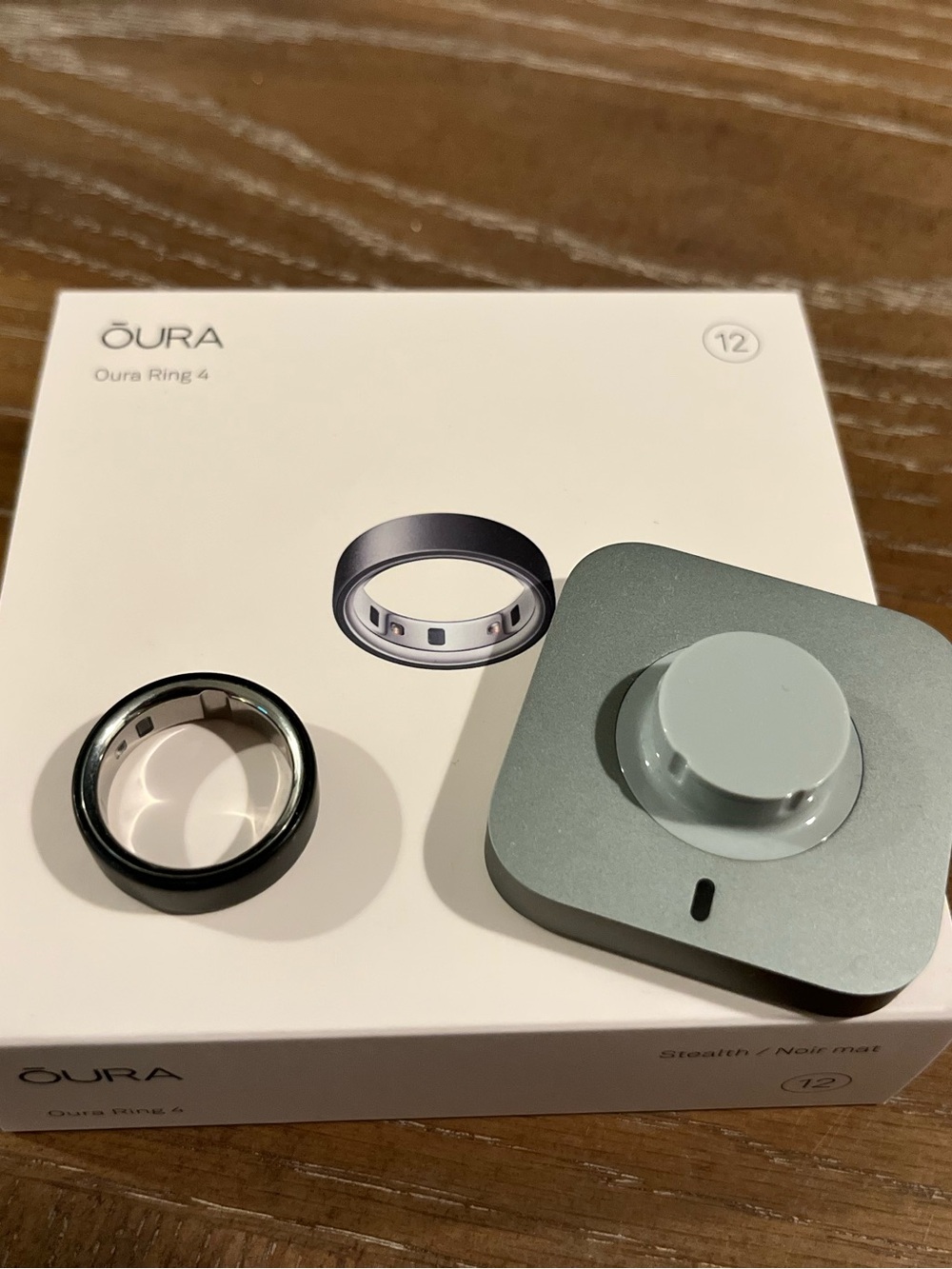 Oura Ring 4 in Black with Silver Inner Band and Gray Charger size 12